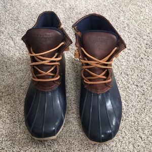 Worn Sperry duck boots